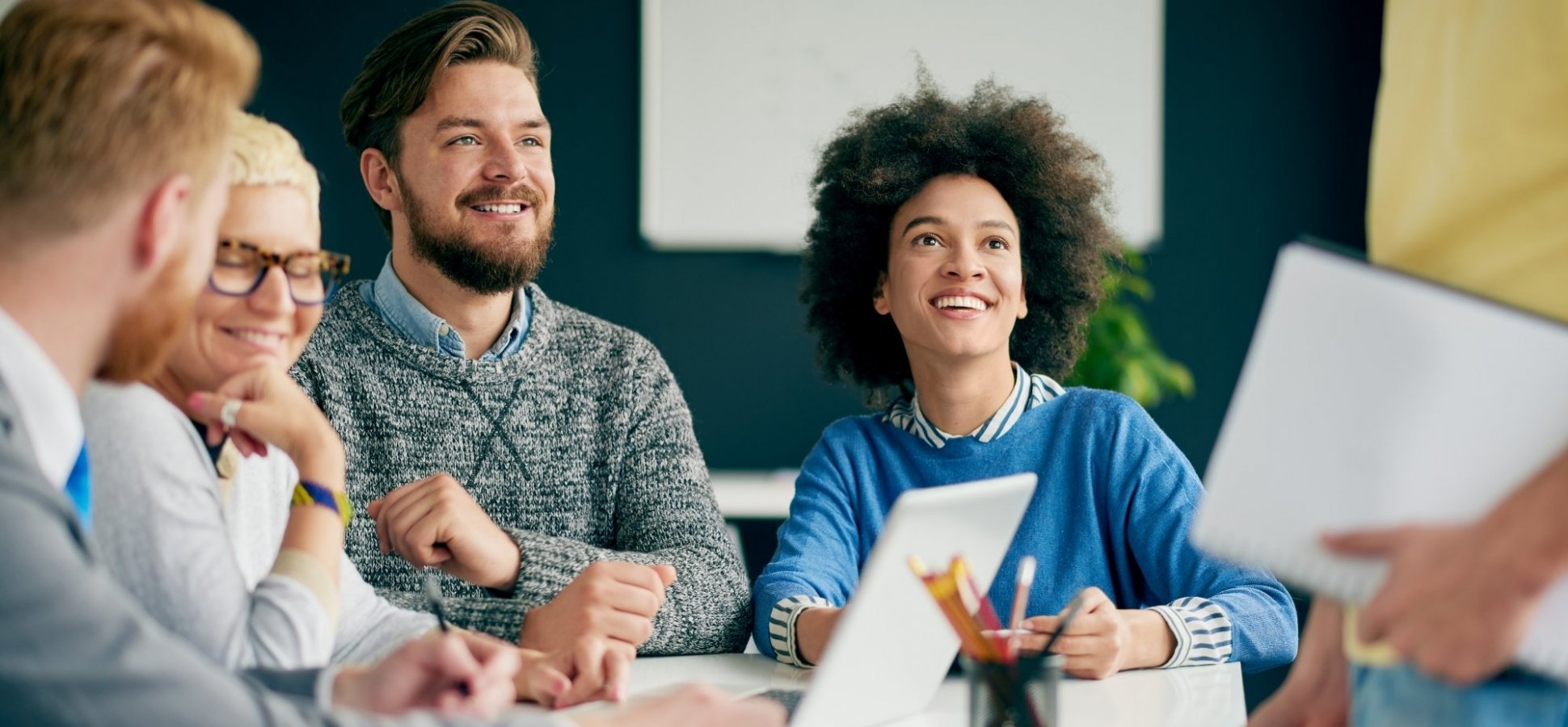 Employees meeting, symbolizing easy and streamlined onboarding with Patriot I-9 software